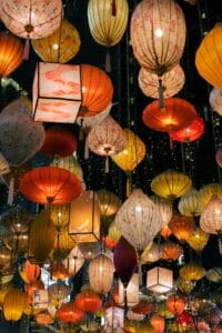 Vibrant collection of hanging lanterns lighting up the night in a colorful festival display.
